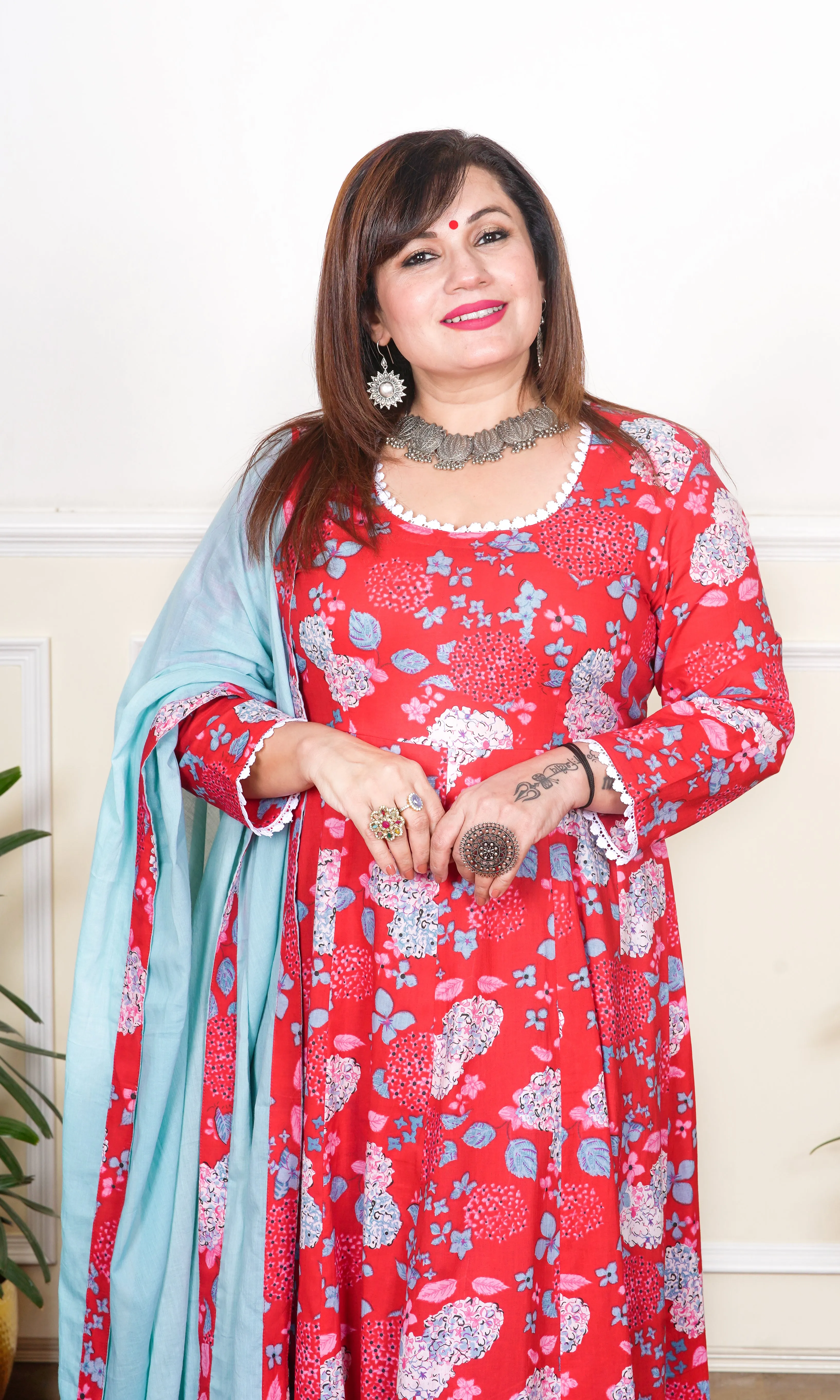 RED AND TURQUOISE FLORAL PRINTED WITH LACE DETAILING KALIDAAR KURTA, WITH PANT AND DUPATTA.